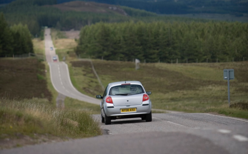 Car driving on small road