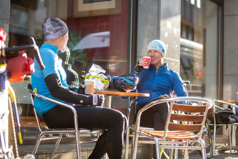Cyclists drinking coffee in Inverness