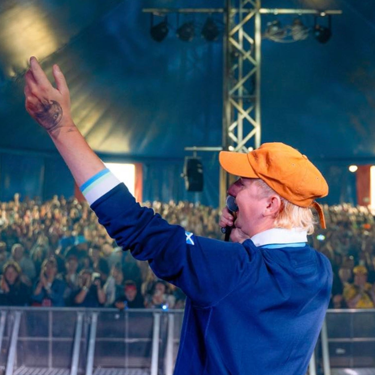 The Jarad Rowan Band performing on stage with the crowd in front of them